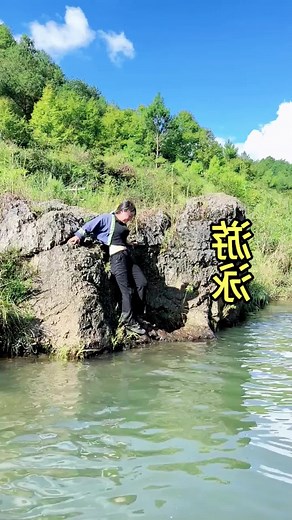 Girl Swimming with Clothes On in a River
