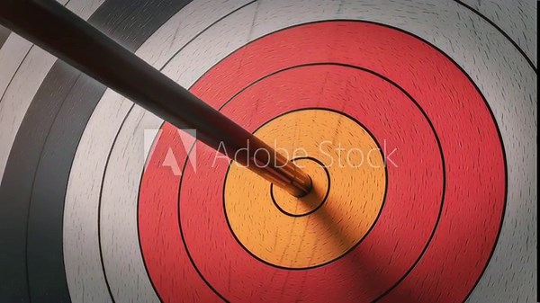 Dramatic video of arrow hitting target bullseye in macro shot showing precision and success in business strategy