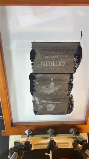 Install the screen printing press and begin printing.