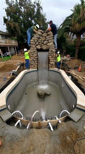Luxury Backyard Pool with Natural Rock Waterfall