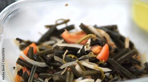 This edible fiddlehead fern shoot salad also know as Warabi salad is a tasty green salad commonly found at many gatherings throughout Hawaii