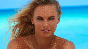 Tennis ace Caroline Wozniacki stuns as she bares all for beach photoshoot
