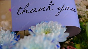 Card saying thank you. Glare lights, blinking string lights. Celebration atmospheric mood