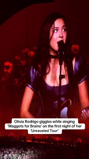 #OliviaRodrigo giggles while singing ‘Maggots for Brains’ on the first night of her #UnraveledTour.