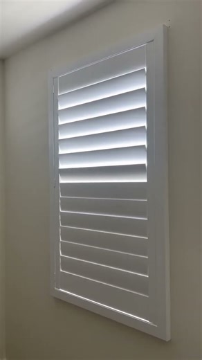 Small plantation shutters in a bedroom