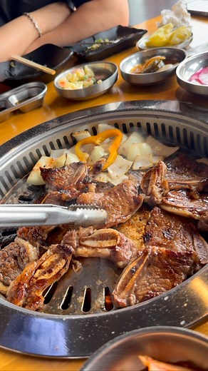 21 reactions | At KPUB Korean BBQ, grilling Kalbi short ribs right at...