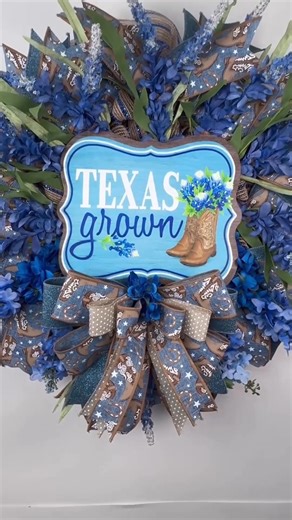If you’re searching for a Texas Grown Western wreath, a cowboy-inspired front door wreath, or a bold and beautiful blue bonnets floral summer wreath, this handmade piece is just for you! This wreath is full of personality, with layers of high-quality designer ribbons, vibrant artificial florals, and a rustic “Texas Grown” sign that features cowboy boots and a little pop of country charm. It’s perfect for showing off your Texas roots or giving your home a little Southern hospitality all summer lo