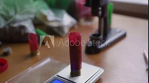reloading process shotgun shells with special reload equipment. The hunter prepares for the hunt - he creates cartridges himself Stock Video