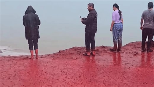 Tourists Watch As The Sea Turns Blood Red On The Iranian Island Of Hormuz