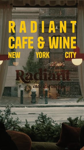 Radiant Cafe & Wine Bar is a small, intimate café and wine bar tucked into the West Village, Manhattan. Though compact, the space feels thoughtfully composed. A half-circle bar anchors the room, while window-side seating opens onto one of the West Village’s quietly charming streets—making the experience feel warm, personal, and memorable. A simple clothes rack at the entrance clears visual clutter and adds a subtle touch of hospitality, allowing the space to breathe despite its size. Save this f