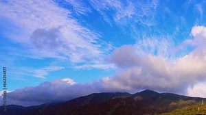High-altitude and low-altitude clouds cross and fly past each other.The wide beauty sky and billowing cloud form a spectacular environment video. Pingtung County ,Taiwan. 4K. Time lapse.