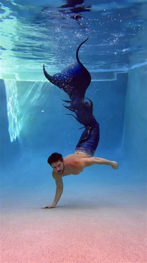 Thomas Tallman on Instagram: "🧜🏻‍♂️💙 Big Blue is BACK. 6 years later and he still fits (barely 😅) — my very first silicone tail from @merrowfins. This is the one that started it all. From awkward pool flips to full-blown underwater fantasy, this tail has seen things. This reel is a little throwback, a little glow-up, and a whole lot of “how the heck did I not drown filming this?” 😵‍💫 🎥 Watch closely: Every clip is a flash of memory, fast, fluid, and full of feels. Drop a 🐬 if you’ve been