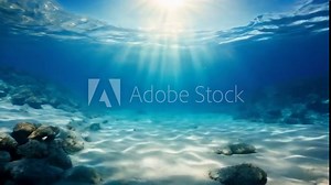 Ocean floor view looking upward, sunlight filtering through waves. Light patterns dance on the sandy bottom. Clear water, no marine life visible. Serene and tranquil, highlighting underwater natural