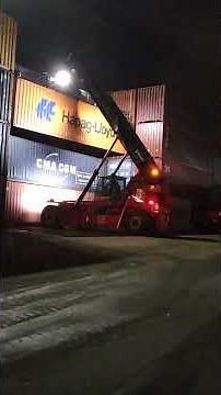 Kalmar Reach stacker with a tilting spreader for container handling