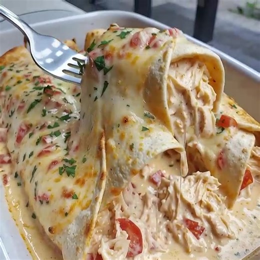 Queso Chicken Enchiladas These creamy chicken enchiladas smothered in cheesy queso, sour cream, and mild green chilies make the perfect weeknight comfort meal. Ingredients Tortillas and Fillings 5 burrito-size flour tortillas 2 ½ cups shredded chicken ½ packet taco seasoning 1 cup sour cream 1 cup shredded cheddar cheese 2 tablespoons chopped green chilies Queso Sauce 10 ounces diced tomatoes with green chilies, undrained 1 pound queso blanco Velveeta, cubed Steps In a large bowl, combine shredd