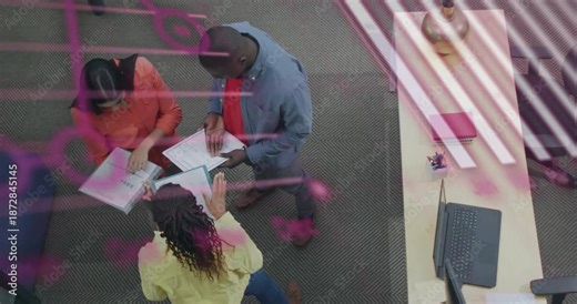 Team flipping binder pages and animating code with graph overlays, converging on chart for project