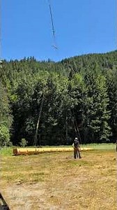 Chinook helicopter lifting 16,000 pound log bridge