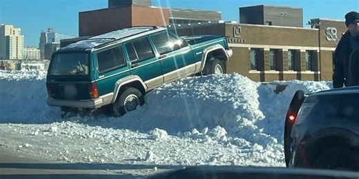 I-35 temporarily delayed after crash left car partially hanging over bridge