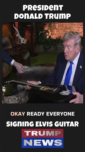 Trump Signs Elvis Guitar
