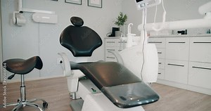 Dental, equipment and seat with teeth cleaning tools for implant, extraction or surgery at clinic. Empty, interior or dentistry of instruments, sanitary hygiene or private practice for mouth care