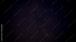 Night sky timelapse, many stars with satellites passing by, Eagle nebula faintly visible Stock Video