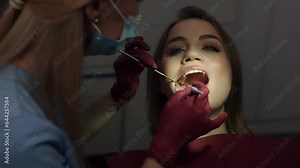 Advanced Medicine, Oral hygiene, Cavity treatment. Doctor diligently investigates mouth for any signs of tooth decay, promoting methods to prevent and treat caries.
