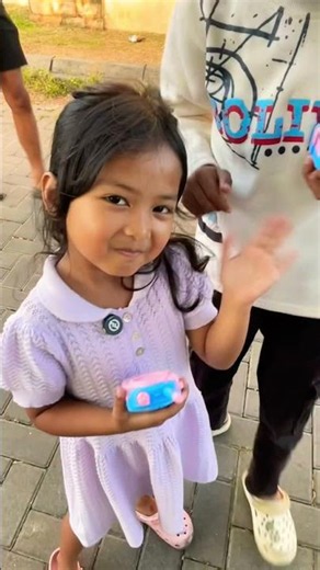 Ayu and Zaki playing with walkie-talkies