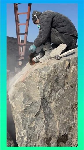 Cutting solid stone with a handheld grinder to shape clean lines and sharp edges