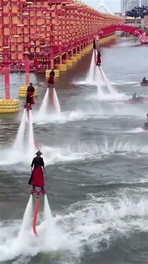 Flyboarding is an extreme water sport where a rider stands on a board connected to a jet ski.