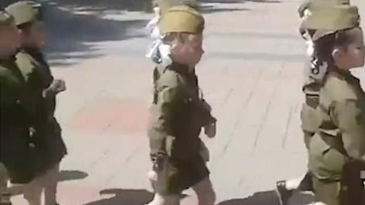 Russian children are taught marching in military uniforms