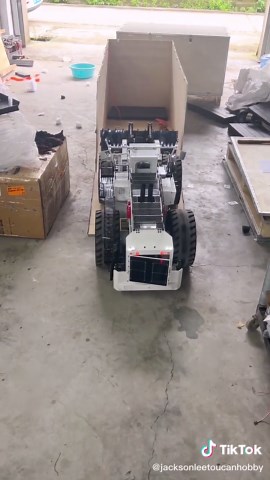 No sooner had the L2350 loader's tracks crossed the box edge than the steel giant started to rein in its power. Don't be deceived by my looks—I can tear through mounds on the worksite, yet tuck myself neatly into your