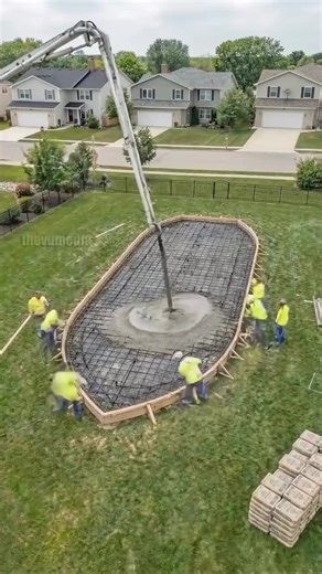 Watch as a massive, grand wooden pirate ship is built from the ground up in a suburban backyard. This incredible architectural time-lapse starts with the foundation and progresses through framing, decking, and the final decorative touches. The result is a multi-level masterpiece featuring a built-in swimming pool, multiple sun decks, custom pergolas, and even a carved bowsprit. At night, the ship transforms into a glowing oasis with vibrant blue underwater lighting and warm amber LEDs lining the