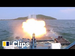 Chinese amphibious armoured troops conduct live-fire military exercise at sea