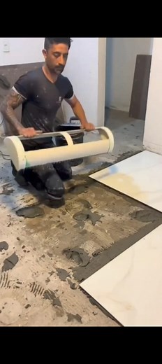 Smart Tile Leveling With Floor Roller 😎 | Perfect Floor Finish Trick 🟦 --- 🧱 Description: Dekho bhai, yeh hai large floor tiles lagane ka smart aur professional tareeka 👷‍♂️ Mortar lagane ke baad floor roller se poori surface press ki ja rahi hai — taaki air bubbles nikle aur har tile ka 100% contact bane 🔥 Process Steps: 1️⃣ Subfloor pe tile adhesive/mortar evenly spread karo 2️⃣ Large tiles ko line & level ke saath place karo 3️⃣ Floor roller se press karo – air bubbles free, tight bond a