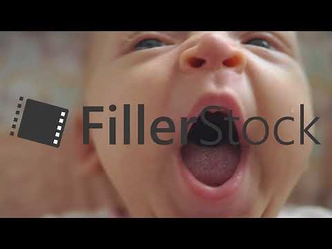 Sleepy baby girl yawning