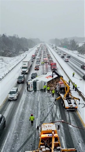 TRAFFIC NIGHTMARE Cargo truck overturns on snow-covered highway. Rescue teams are working to clear the scene and spilled cargo, but traffic will remain congested for some time. | World Archaeology