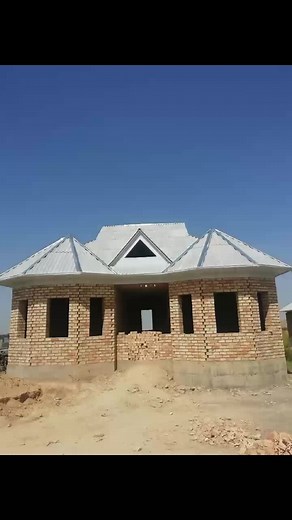 Constructing a Modern Brick House with Triangular Roof