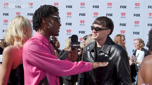 Peso Pluma Clears Up Anitta Dating Rumors, Talks Coachella & More | iHeart Radio Music Awards 2024