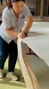 Ever seen the process of cutting giant Xuan paper? #XuanPaper, a traditional Chinese paper known for its longevity. This paper can last for a thousand years, making it a true cultural treasure. #Heritage #Culture #Art #History | Fantastic China