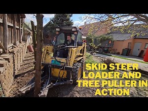 Powerful Wood Removal: Watch the Skid Steer Loader and Tree Puller in Action!