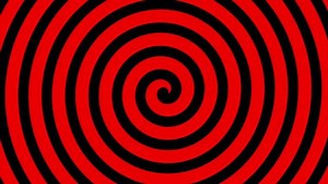 Black hypnotic spiral rotates on the red background. Seamless loop. More color backgrounds available - check my portfolio.