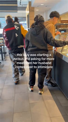 Watch this Chipotle go from normal order to straight chaos in seconds.Lady in the headscarf starts throwing a fit demanding extra meat. Her husband (varsity jacket guy) immediately steps in like a bodyguard to intimidate the workers. Next thing you know, he’s behind the counter putting hands on the employee over some extra chicken.Bro really risked jail time, a lifetime ban, and catching a case… all for more scoops in his burrito bowl?