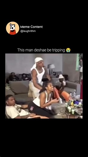 Meme Content on Instagram: "In this chaotic and high-energy video, a group of young friends is gathered in a casual living room setting, lounging on a large grey sectional sofa with a coffee table full of drinks and snacks in front of them, when the atmosphere is suddenly disrupted by the frantic antics of one man standing in the center. Dressed in a white tank top, do-rag, and shorts, this individual begins acting in a wildly erratic manner, physically startling a woman sitting on the couch by 