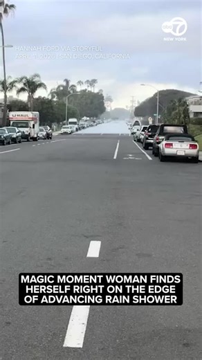 A woman was astonished to find herself right at the edge of an advancing rain shower, standing perfectly dry in front of the oncoming downpour for a few memorable moments. This footage was captured in San Diego on April 11 by Hannah Ford. She told Storyful that while out for a walk she saw what looked to be a pool of water coming down the road. “I was confused and wondered if a fire hydrant had busted down there, but then I realized it was a wall of rain approaching me. The line of rain moved cl