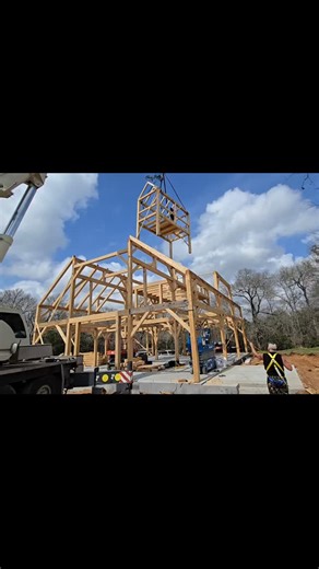 A year ago today we flew 9'x17' pre-assembled cupola into place on the 3rd floor of a big beautiful Texas barn! The weather was a bit better too! #timberframe #barn #mortiseandtenon #timberframing #construction | Ward Timber Frames, LLC