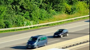 blurred traffic of cars that travel fast on A5 expressway in Germany, daytime traffic in suburbs of Frankfurt am Main, trucking concept, pendlers returning from work, top view