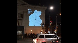 Trump and Putin spoon in satirical cartoon projected on New York block: https://yhoo.it/2kr0KBo (Credit: Instagram/dougjberman) | Yahoo Canada