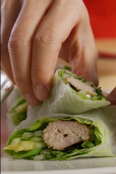 Vietnamese spring rolls with skewered meat and fresh veggies