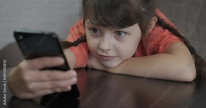 Browser for children. A happy little girl relax in internet on a browser for children.