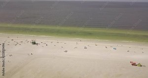 Drone of Siesta Key beach moving towards ocean horizon